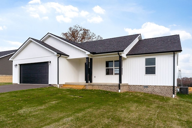 modern inspired farmhouse featuring aphalt driveway, crawl space, central AC, a garage, and a front lawn