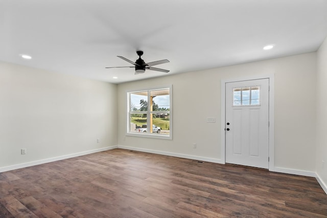 foyer with a wealth of natural light, dark wood finished floors, baseboards, and recessed lighting