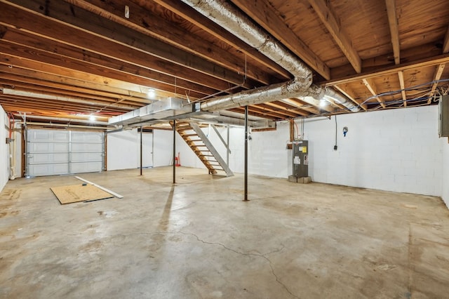 unfinished basement featuring water heater