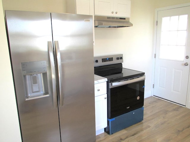 kitchen featuring under cabinet range hood, white cabinets, appliances with stainless steel finishes, and light wood-type flooring