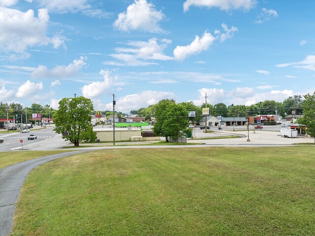 view of home's community featuring a lawn