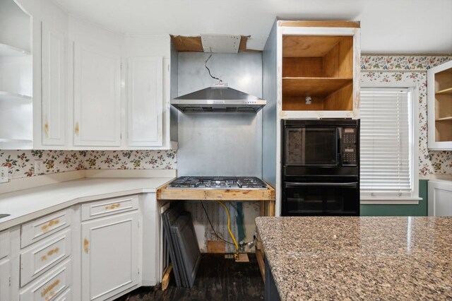 kitchen featuring open shelves, exhaust hood, white cabinets, black appliances, and wallpapered walls