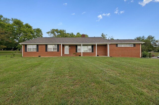 ranch-style house with crawl space, brick siding, and a front lawn