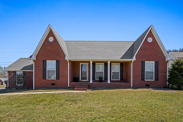 view of front of home featuring a front yard, crawl space, and brick siding