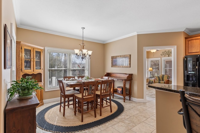 dining area with baseboards and ornamental molding