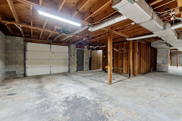 garage with concrete block wall