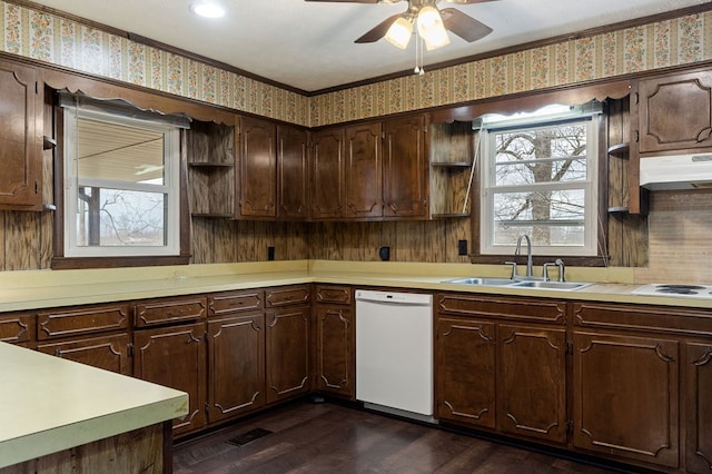 kitchen featuring under cabinet range hood, white appliances, a sink, light countertops, and wallpapered walls