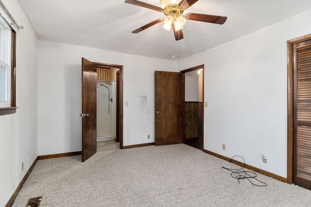 unfurnished bedroom featuring a closet, baseboards, a ceiling fan, and light colored carpet