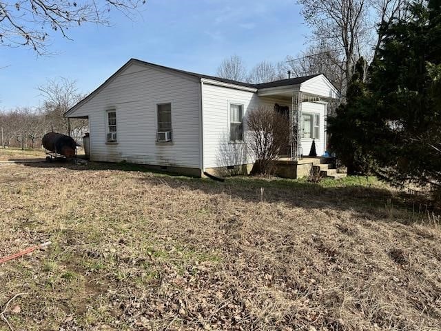 exterior space with crawl space and cooling unit