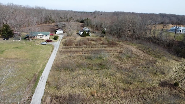 aerial view with a rural view and a wooded view