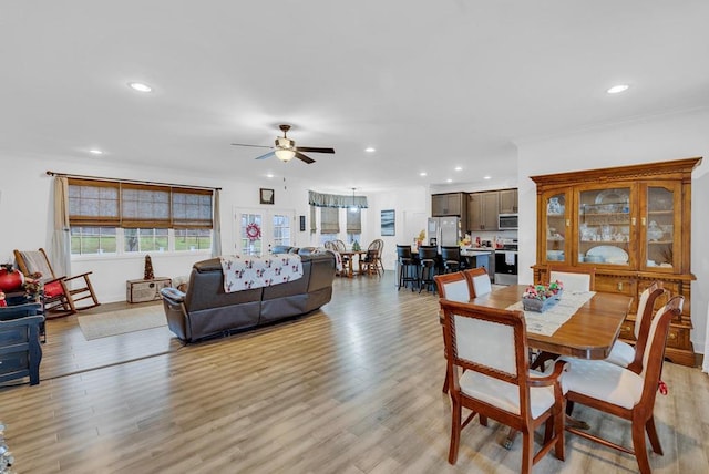 dining area with recessed lighting, a ceiling fan, and light wood-style floors