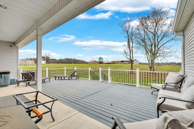 wooden terrace featuring a yard