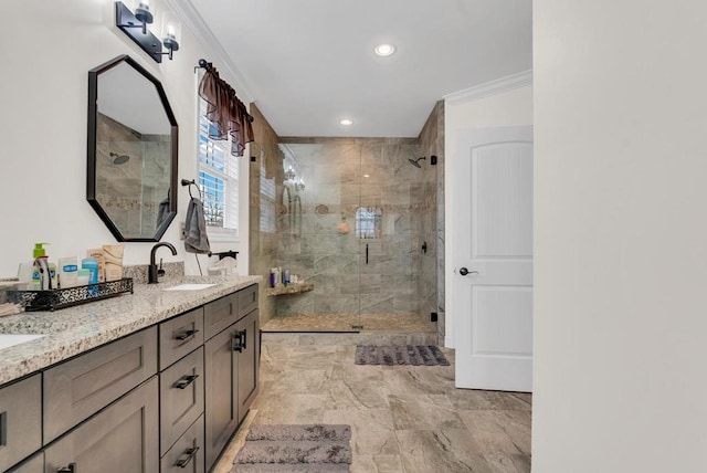 full bathroom featuring crown molding, double vanity, recessed lighting, a stall shower, and a sink