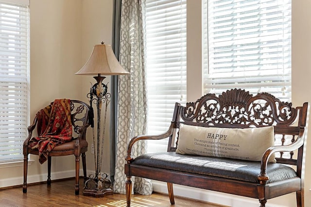 sitting room with wood finished floors and baseboards