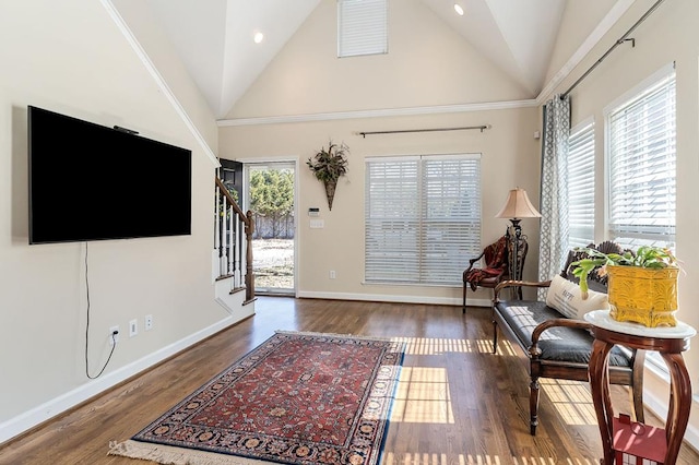 interior space featuring high vaulted ceiling, recessed lighting, wood finished floors, baseboards, and stairway