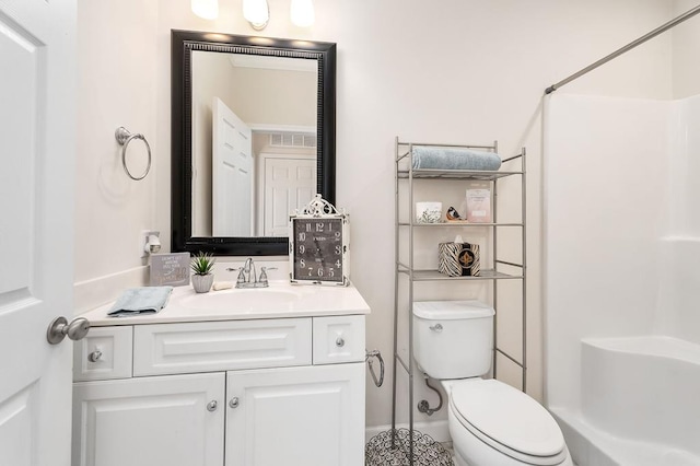 full bath with visible vents, vanity, walk in shower, and toilet