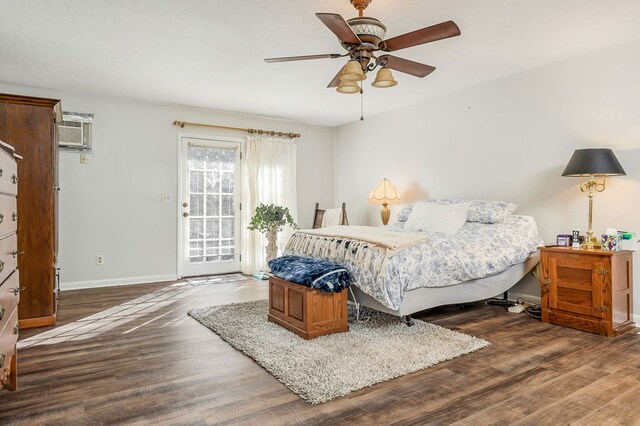 bedroom featuring wood finished floors, a ceiling fan, baseboards, access to exterior, and a wall mounted air conditioner