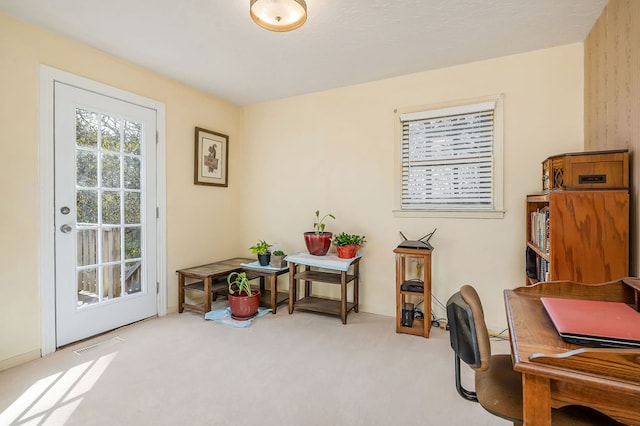 office area with carpet flooring and visible vents