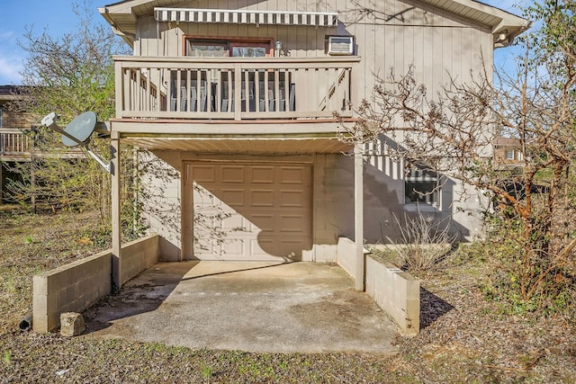 exterior space with a balcony and an attached garage