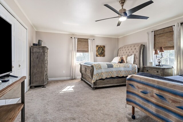 bedroom featuring baseboards, ceiling fan, ornamental molding, and light colored carpet