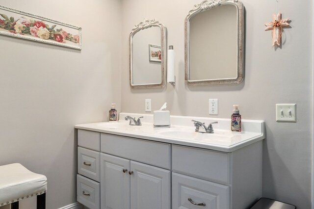 bathroom featuring double vanity and a sink