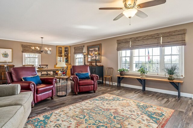 living area featuring a wealth of natural light and crown molding