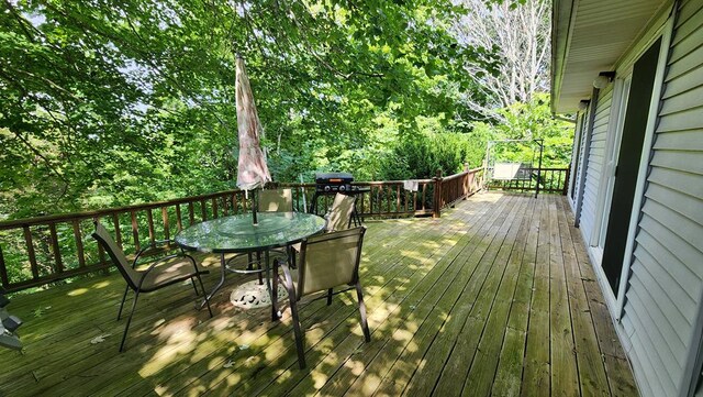 wooden deck with outdoor dining area