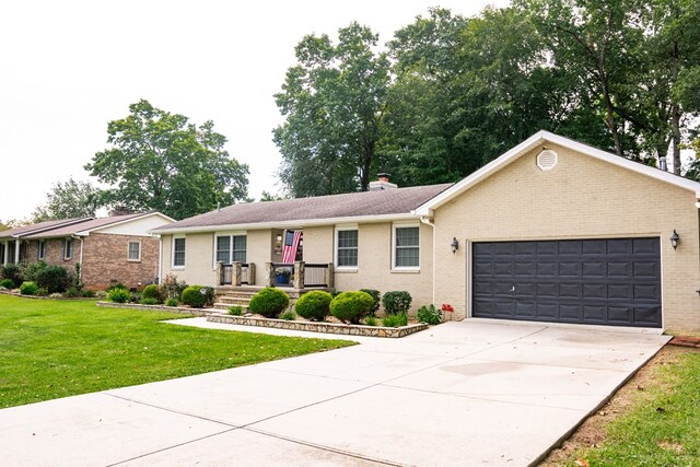 single story home featuring a garage, brick siding, driveway, a front lawn, and a chimney