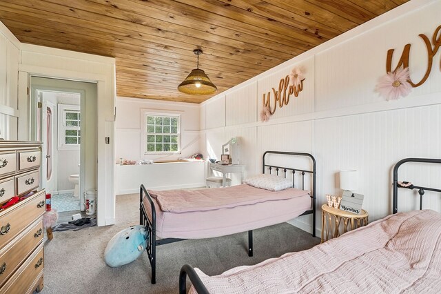 bedroom featuring carpet and wooden ceiling