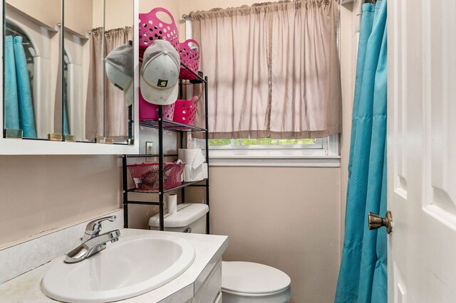 full bath with vanity and toilet