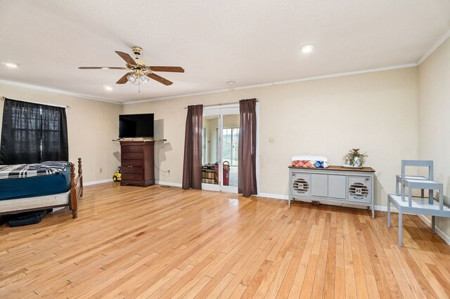 bedroom with ornamental molding, light wood-type flooring, baseboards, and a ceiling fan