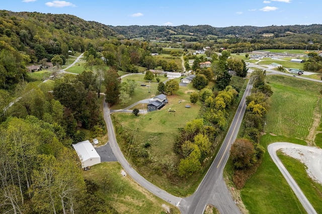 birds eye view of property with a wooded view