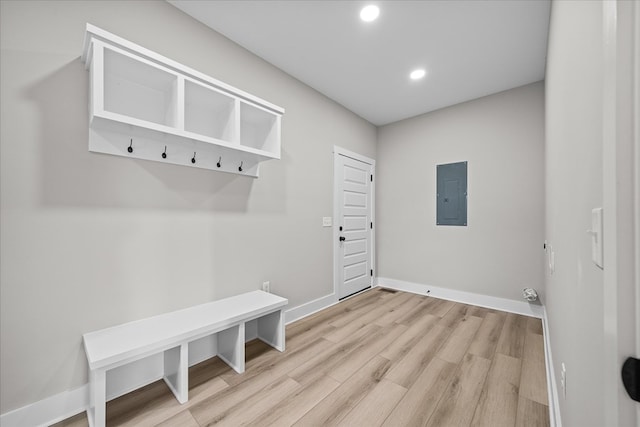 mudroom with light wood-style floors, recessed lighting, electric panel, and baseboards