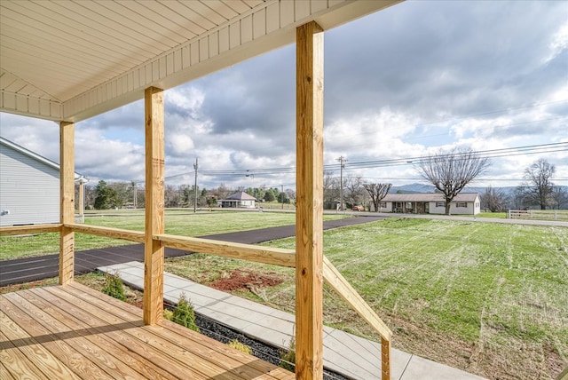 wooden deck with a yard