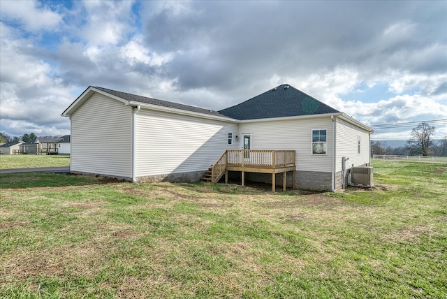 back of house featuring central AC, stairway, a lawn, and a wooden deck