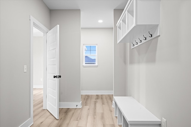 mudroom with light wood-type flooring, baseboards, and recessed lighting