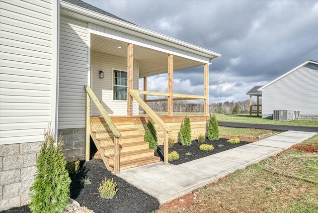 doorway to property with central AC unit