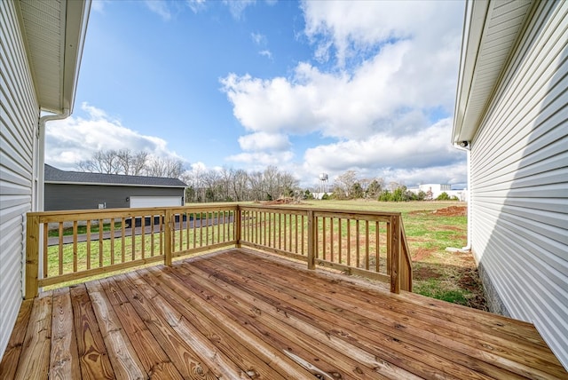 wooden terrace with a yard