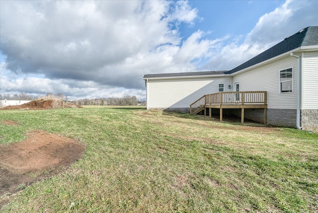 view of yard featuring a wooden deck