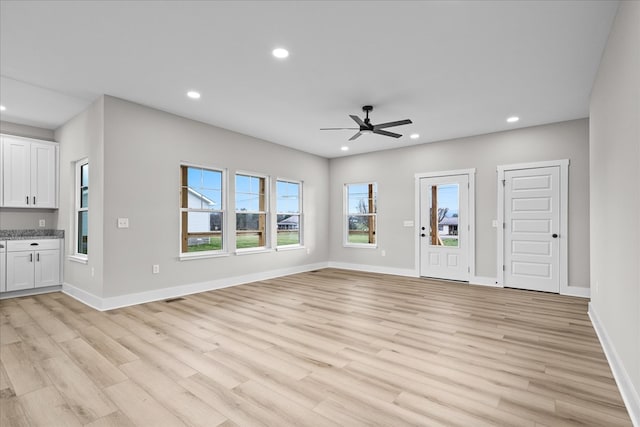 unfurnished living room featuring light wood finished floors, visible vents, baseboards, ceiling fan, and recessed lighting