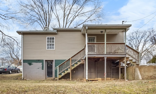 back of house featuring stairway