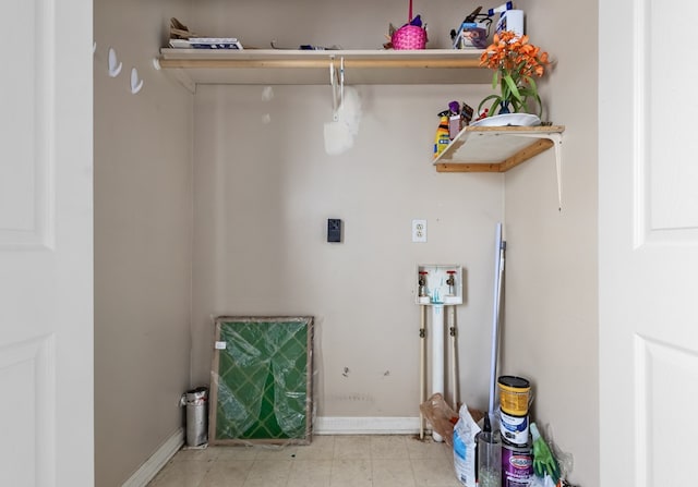 laundry room with laundry area and baseboards