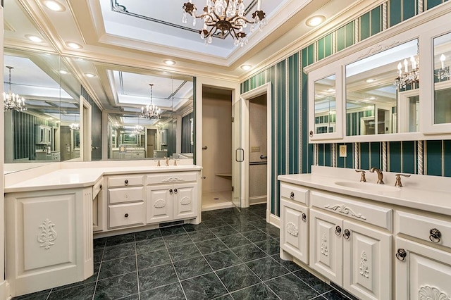 bathroom featuring a sink, wallpapered walls, crown molding, and a notable chandelier