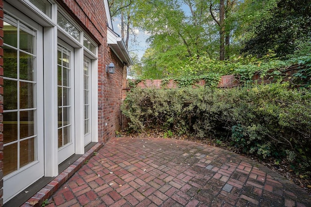 view of patio featuring fence