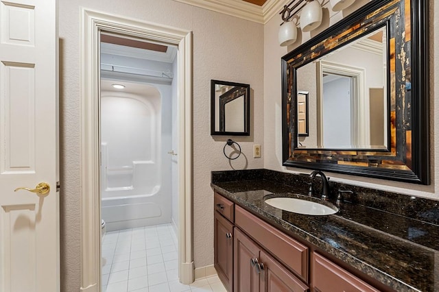 full bathroom featuring a textured wall, toilet, ornamental molding, tile patterned flooring, and vanity