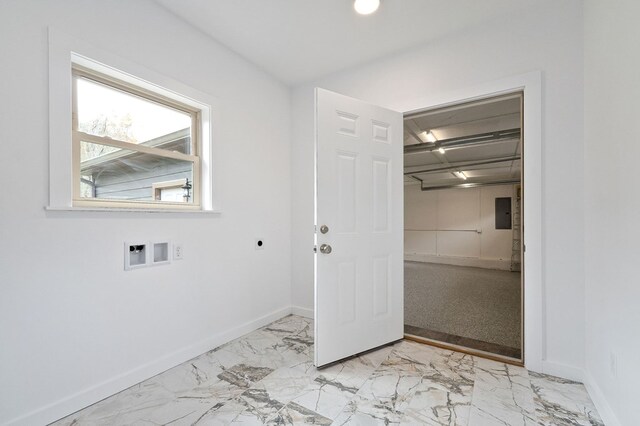 laundry area featuring hookup for a washing machine, laundry area, marble finish floor, and baseboards