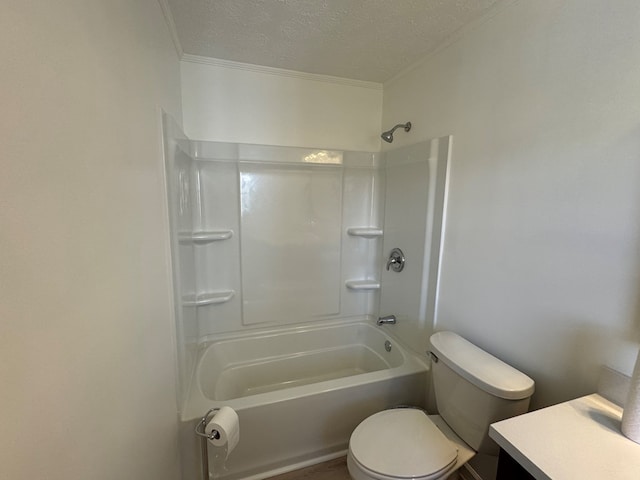 bathroom with vanity, ornamental molding, toilet, and a textured ceiling