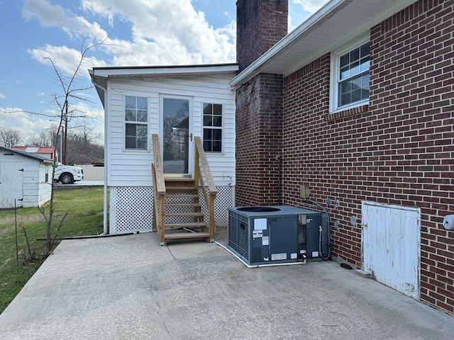 view of patio with entry steps and central AC unit