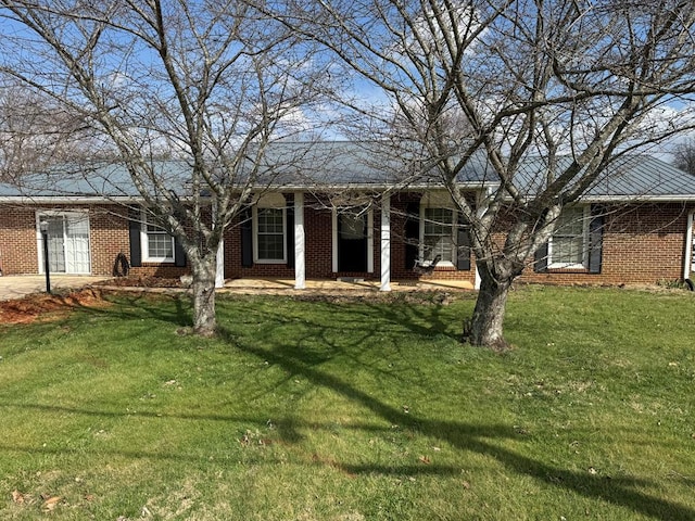 ranch-style house with a front lawn and brick siding