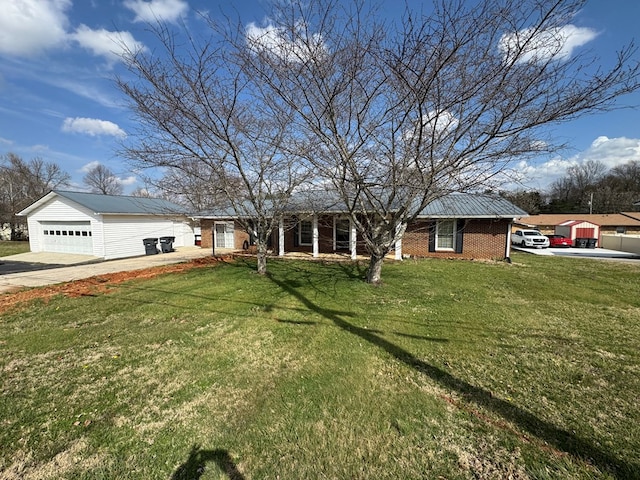 single story home with a front yard, brick siding, a garage, and driveway